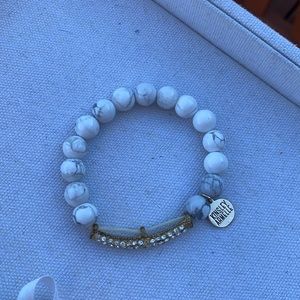 Kinsley Armelle white and grey marbled bracelet.